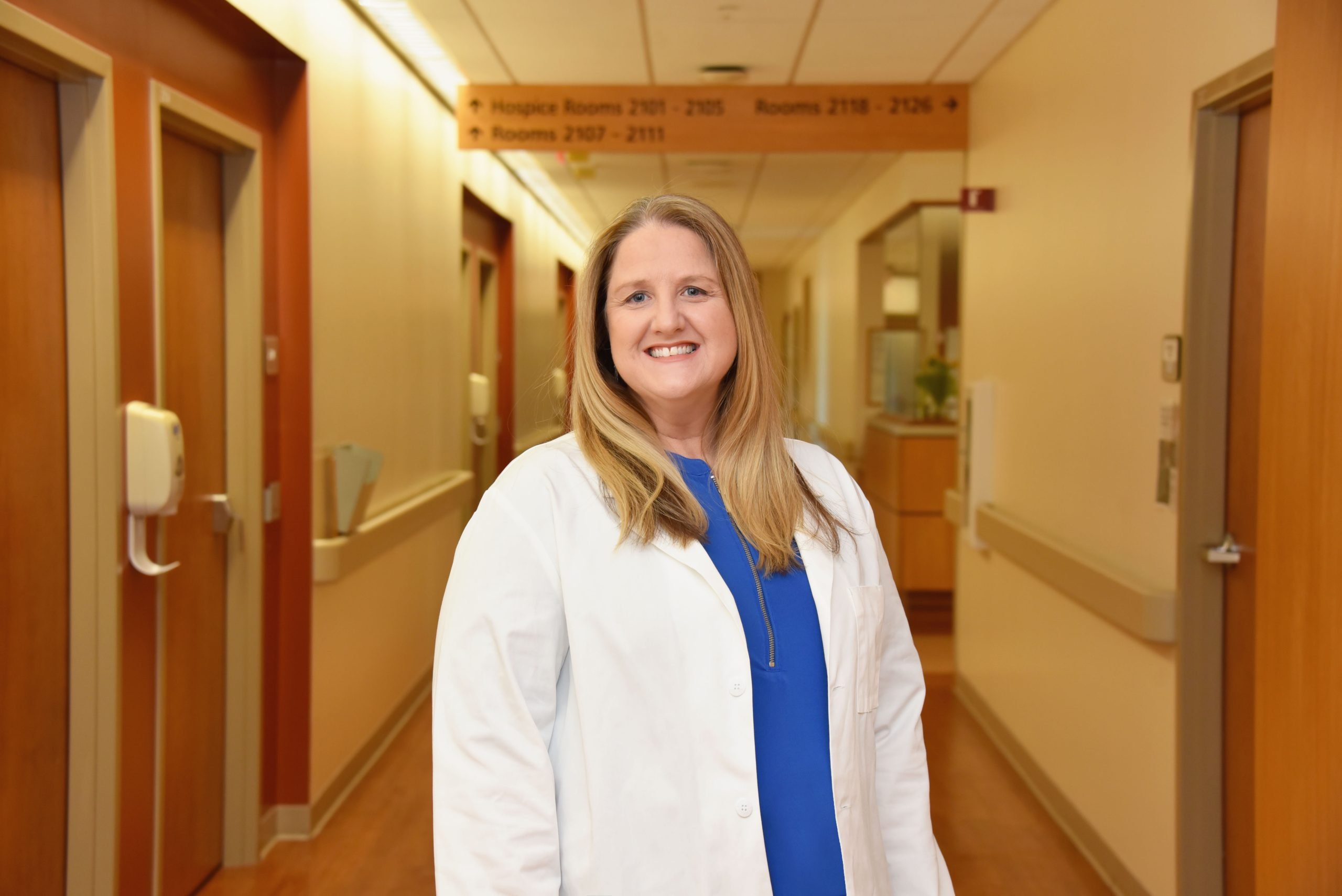 Jessica Lainhart, Family Nurse Practitioner, smiles warmly in her lab coat, excited to see new patients at ACRMC Family Medicine in Georgetown.